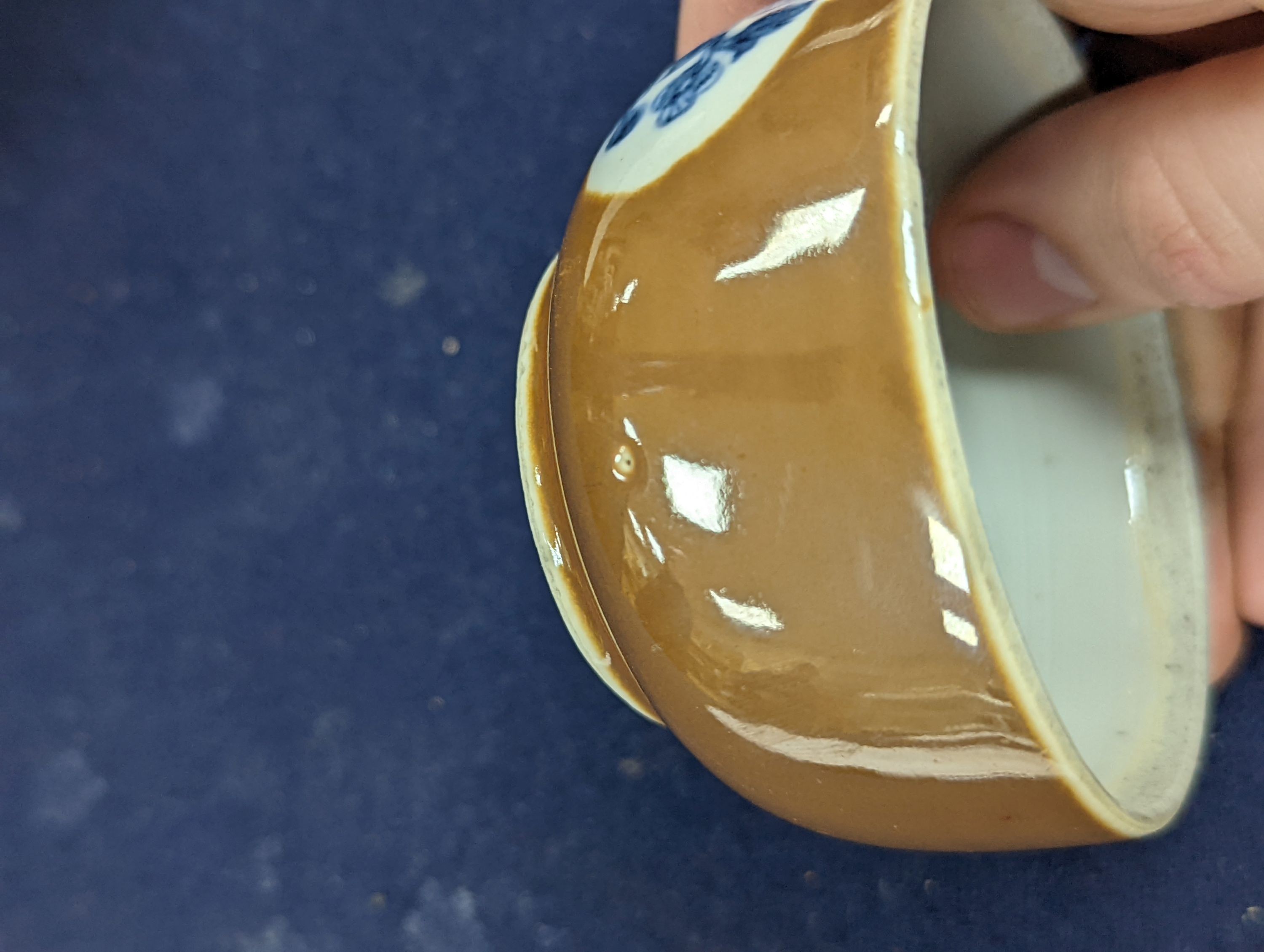 A Chinese cafe au lait glazed saucer, three bowls and a stem cup